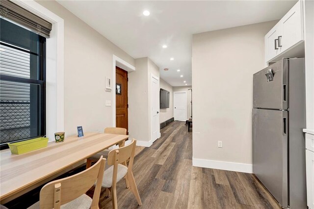 53 Andrews St, Staten Island, NY 10305 - kitchen featuring freestanding refrigerator, dark wood finished floors, white cabinets, baseboards, and recessed lighting
