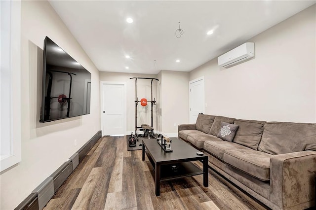 living room with recessed lighting, baseboards, a wall unit AC, and dark wood-style flooring
