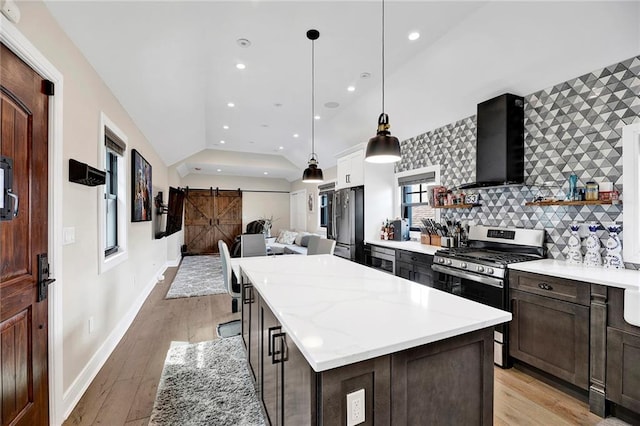 53 Andrews St, Staten Island, NY 10305 - kitchen with gas range, wall chimney exhaust hood, vaulted ceiling, open shelves, and a barn door