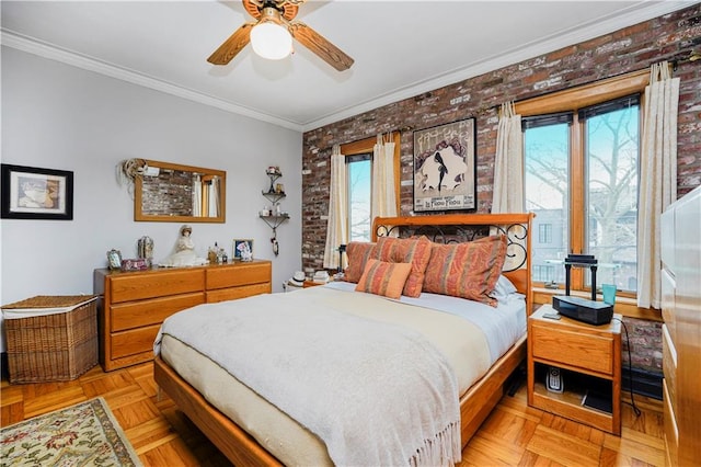 bedroom featuring crown molding, brick wall, and a ceiling fan