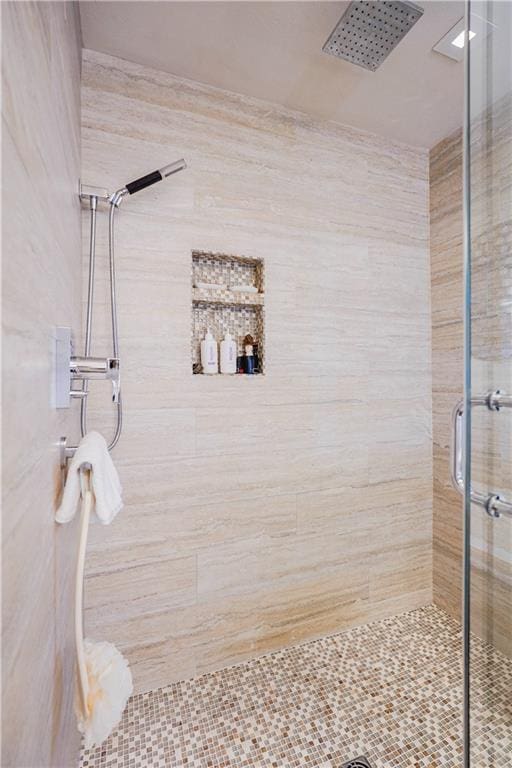 full bath featuring a shower stall