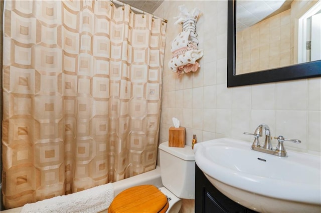 bathroom with tile walls, vanity, toilet, shower / tub combo, and tasteful backsplash