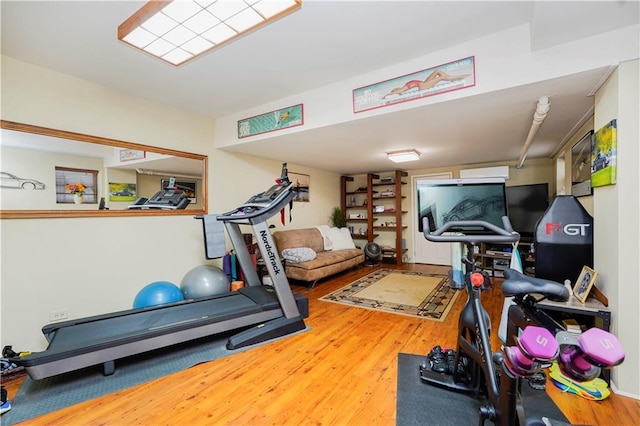 exercise area with wood finished floors