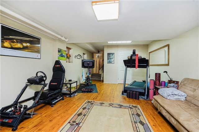 exercise room with wood finished floors