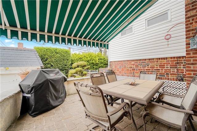 view of patio / terrace featuring outdoor dining area and area for grilling