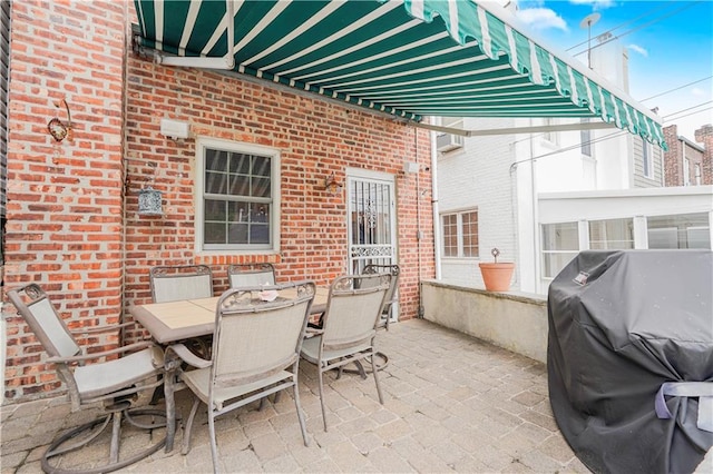 view of patio featuring grilling area and outdoor dining space