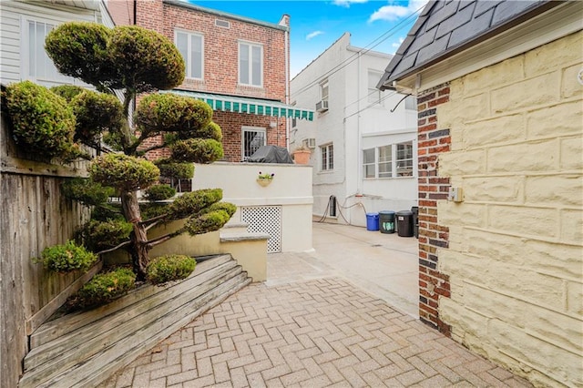 view of patio with fence and a garage
