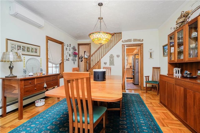 dining space with a wall mounted AC, stairs, a baseboard heating unit, crown molding, and a textured ceiling