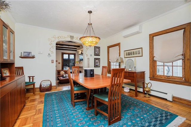 dining space with a wall mounted AC, arched walkways, a baseboard heating unit, ornamental molding, and baseboards