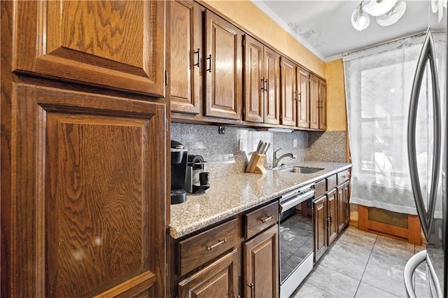 kitchen featuring crown molding, light stone counters, a sink, decorative backsplash, and wine cooler
