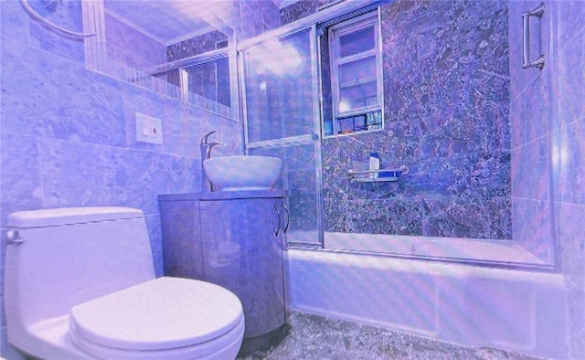 full bath featuring a sink, tile walls, and toilet