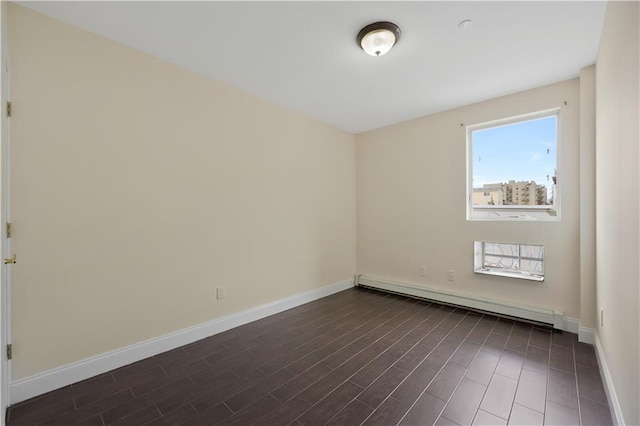 2138 Bath Ave Unit 1A, Brooklyn, NY 11214 - spare room featuring a baseboard heating unit and dark wood-style flooring
