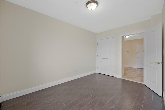 2138 Bath Ave Unit 1A, Brooklyn, NY 11214 - unfurnished bedroom featuring dark wood-style floors and a closet