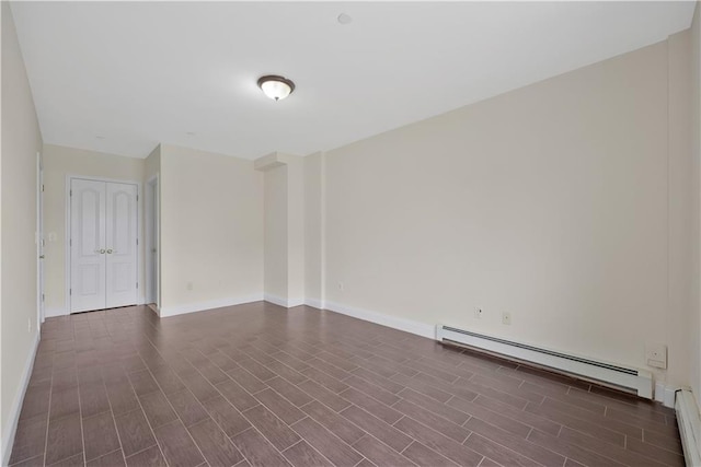 2138 Bath Ave Unit 1A, Brooklyn, NY 11214 - spare room with a baseboard radiator and dark wood-style flooring