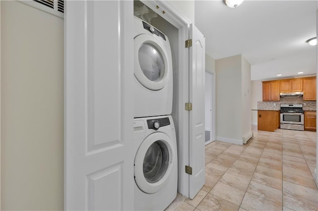 2138 Bath Ave Unit 1A, Brooklyn, NY 11214 - laundry room featuring stacked washer / drying machine, recessed lighting, and light tile patterned floors
