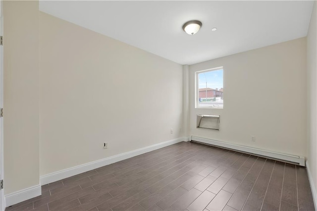 2138 Bath Ave Unit 1A, Brooklyn, NY 11214 - spare room with a baseboard radiator and dark wood-type flooring