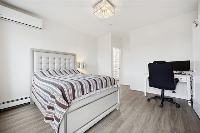 2752 Ocean Ave Unit 6A, Brooklyn, NY 11229 - bedroom with an AC wall unit, wood finished floors, a chandelier, an office area, and a baseboard heating unit