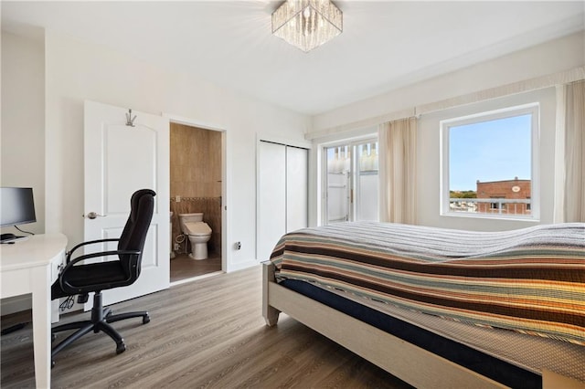 2752 Ocean Ave Unit 6A, Brooklyn, NY 11229 - bedroom featuring wood finished floors, connected bathroom, an office area, and a closet