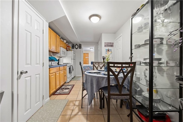 dining space with light tile patterned floors