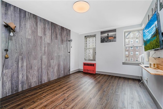 9707 4th Ave Unit 4P, Brooklyn, NY 11209 - unfurnished room featuring radiator, hardwood / wood-style flooring, and plenty of natural light