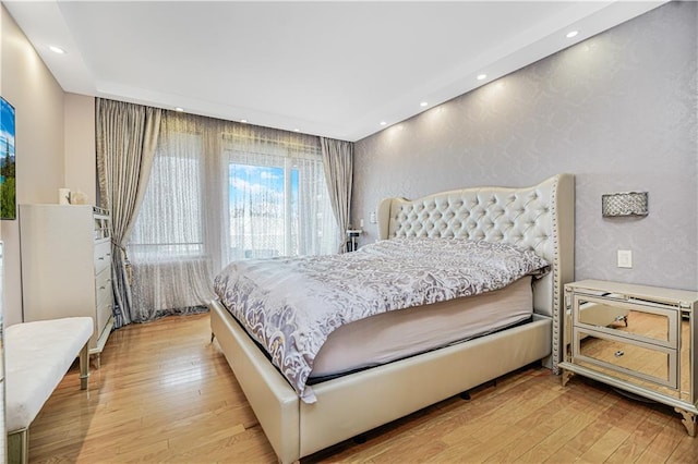 bedroom featuring light wood-style floors and recessed lighting