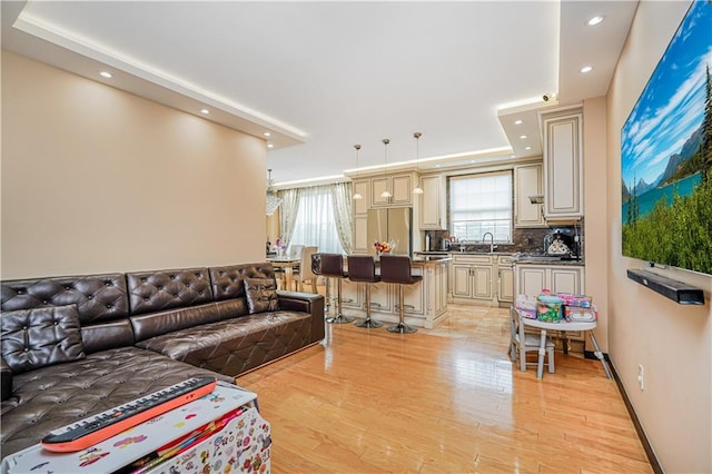 living room featuring recessed lighting and light wood-type flooring