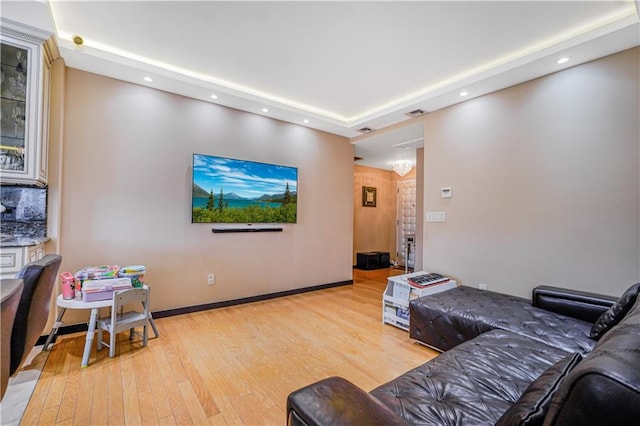 45 Oceana Dr E Unit 4B, Brooklyn, NY 11235 - living room with recessed lighting, light wood-type flooring, a raised ceiling, and baseboards