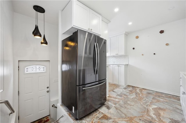 kitchen featuring freestanding refrigerator, white cabinetry, recessed lighting, backsplash, and pendant lighting
