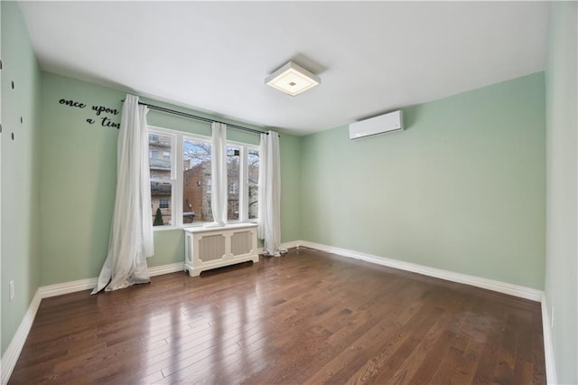 unfurnished room with baseboards, a wall unit AC, radiator, and dark wood-type flooring