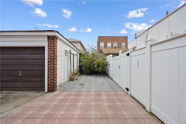 view of side of property featuring fence