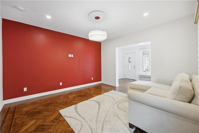 living area with recessed lighting and baseboards
