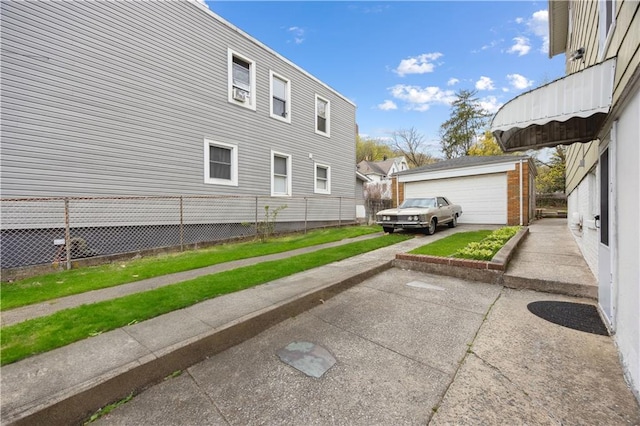 980 Van Duzer St, Staten Island, NY 10304 - view of property exterior featuring a garage, an outbuilding, and fence