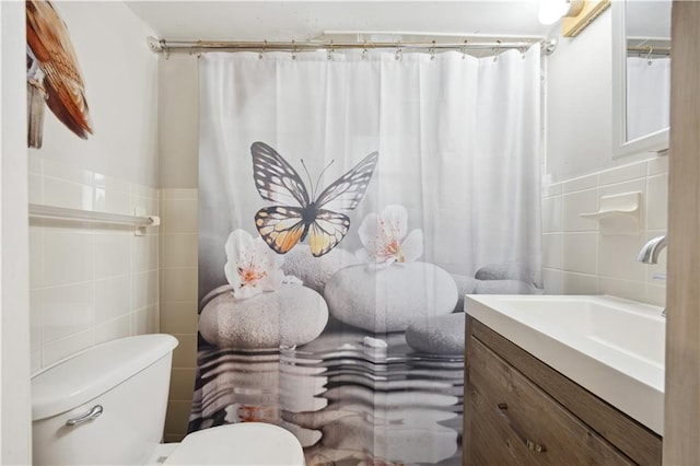 980 Van Duzer St, Staten Island, NY 10304 - full bath with a wainscoted wall, toilet, vanity, a shower with curtain, and tile walls
