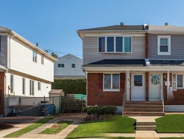 74 E Brandis Ave, Staten Island, NY 10308 - view of front of home featuring brick siding, roof with shingles, and entry steps