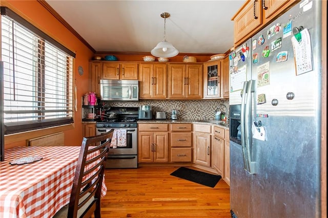 74 E Brandis Ave, Staten Island, NY 10308 - kitchen featuring stainless steel appliances, light wood-style floors, ornamental molding, backsplash, and decorative light fixtures
