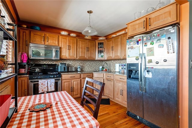 74 E Brandis Ave, Staten Island, NY 10308 - kitchen with appliances with stainless steel finishes, light wood-style flooring, backsplash, glass insert cabinets, and decorative light fixtures