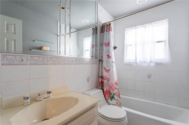 74 E Brandis Ave, Staten Island, NY 10308 - full bath featuring plenty of natural light, tile walls, toilet, vanity, and shower / tub combo with curtain