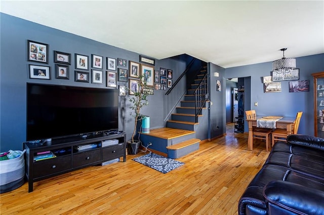 74 E Brandis Ave, Staten Island, NY 10308 - living room with stairway, wood-type flooring, and a chandelier