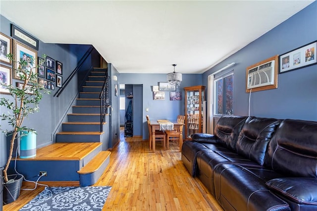 74 E Brandis Ave, Staten Island, NY 10308 - living area featuring a chandelier, stairway, light wood-type flooring, and a wall unit AC