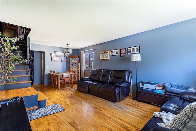 74 E Brandis Ave, Staten Island, NY 10308 - living room featuring a chandelier, light wood-style floors, and stairs