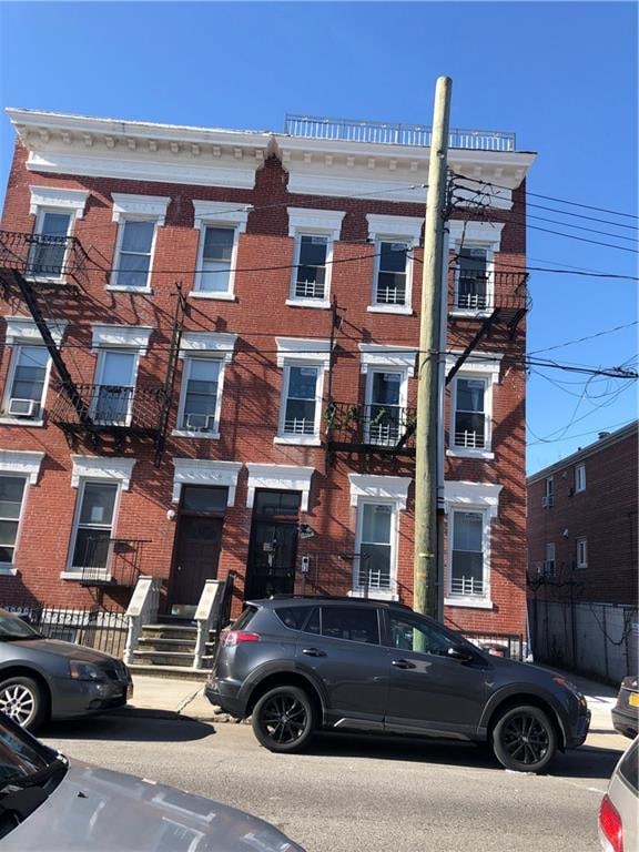 1462 66th St, Brooklyn, NY 11219 - townhome / multi-family property featuring brick siding