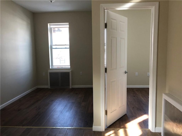 1462 66th St, Brooklyn, NY 11219 - unfurnished room featuring baseboards and dark wood-style floors