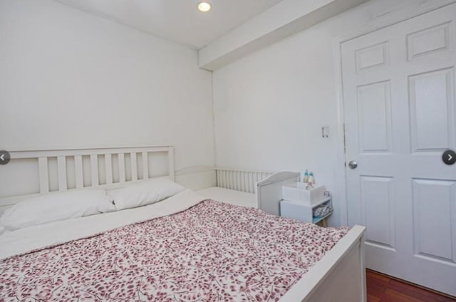 bedroom featuring recessed lighting and dark wood-style floors