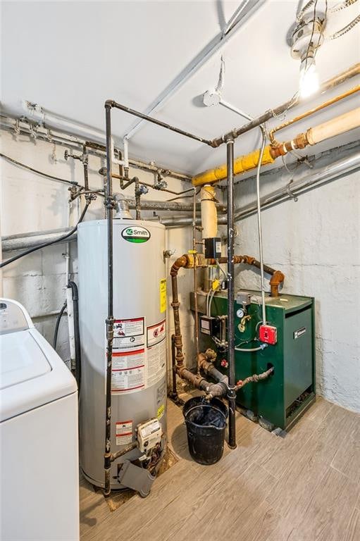 utilities with washer / dryer, water heater, and a heating unit