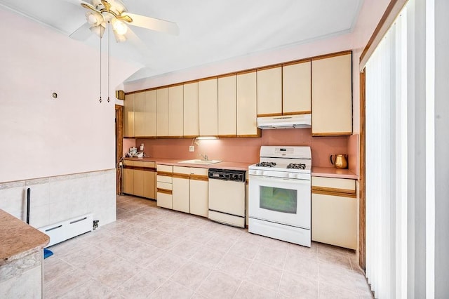 kitchen featuring white appliances, cream cabinets, under cabinet range hood, a baseboard heating unit, and light countertops