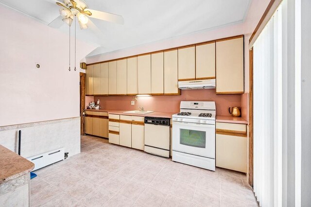 1142 78th St, Brooklyn, NY 11228 - kitchen with white appliances, cream cabinets, under cabinet range hood, a baseboard heating unit, and light countertops