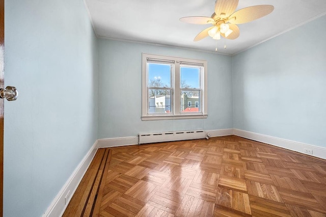 unfurnished room featuring a baseboard heating unit, ceiling fan, baseboards, and crown molding
