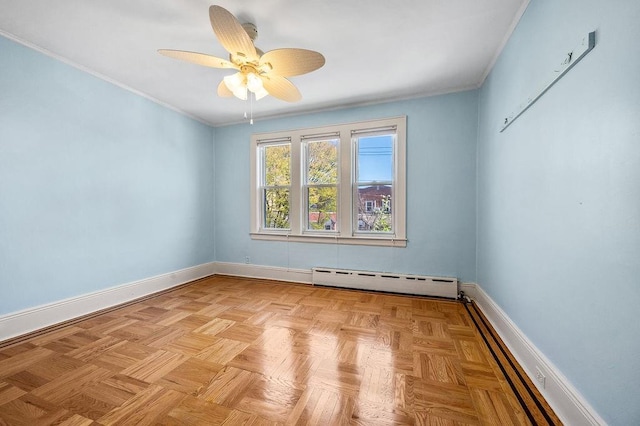 unfurnished room with baseboard heating, baseboards, ornamental molding, and ceiling fan