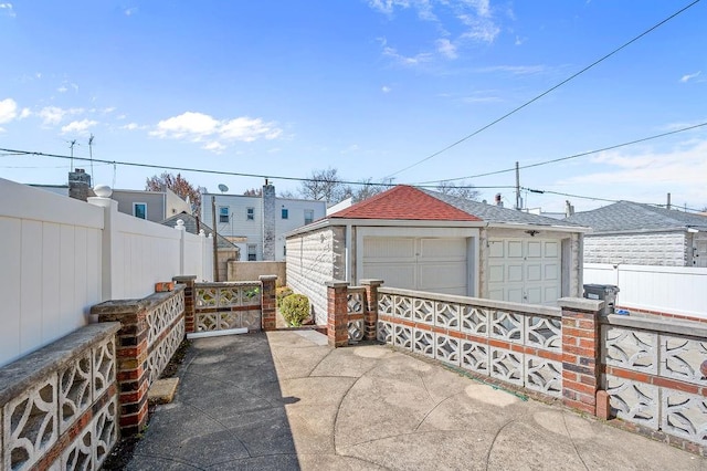 detached garage with fence