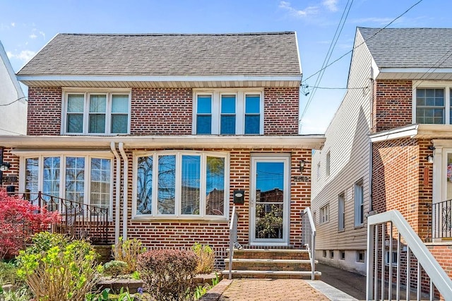 1142 78th St, Brooklyn, NY 11228 - view of front facade with brick siding, entry steps, and a shingled roof